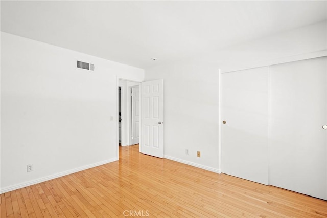 2811 Westbourne Pl, Rowland Heights, CA 91748 - unfurnished bedroom featuring hardwood / wood-style floors, baseboards, visible vents, and a closet