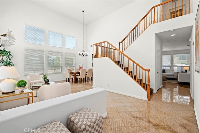 2811 Westbourne Pl, Rowland Heights, CA 91748 - foyer with granite finish floor, baseboards, an inviting chandelier, a high ceiling, and stairway