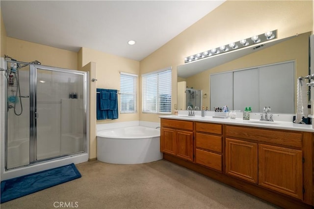 full bath featuring lofted ceiling, visible vents, a sink, and a stall shower