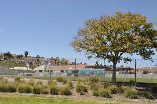 view of home's community with fence