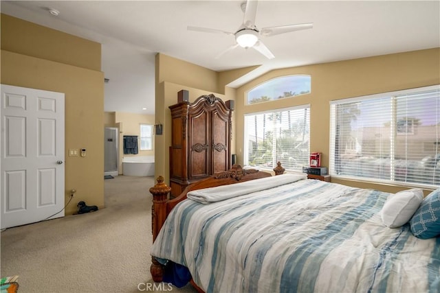 carpeted bedroom featuring vaulted ceiling, ceiling fan, and multiple windows