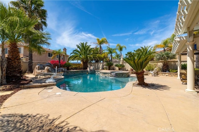view of pool with a patio area, a fenced backyard, and a pool with connected hot tub