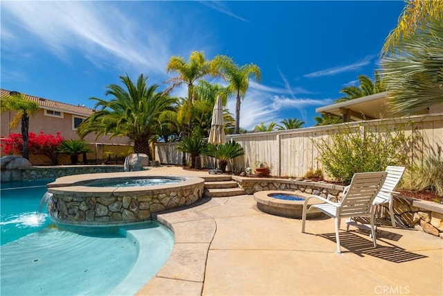 view of swimming pool with a fenced in pool, a fenced backyard, a patio area, an in ground hot tub, and a fire pit