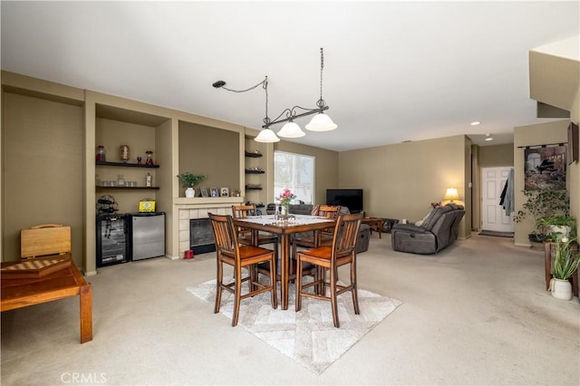 dining room featuring light colored carpet, wine cooler, and recessed lighting