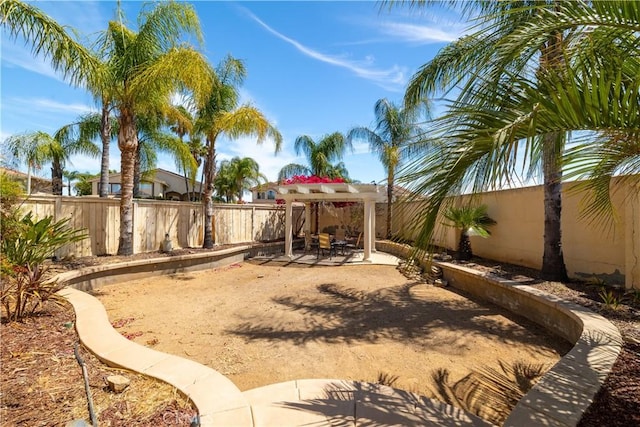 view of yard featuring a fenced backyard, a pergola, and a patio