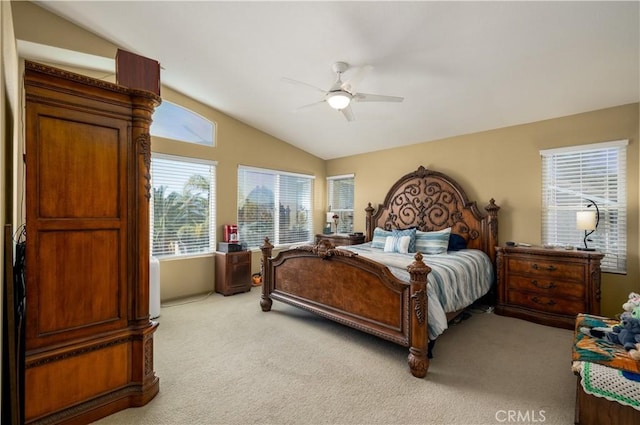 bedroom featuring vaulted ceiling, a ceiling fan, and light carpet