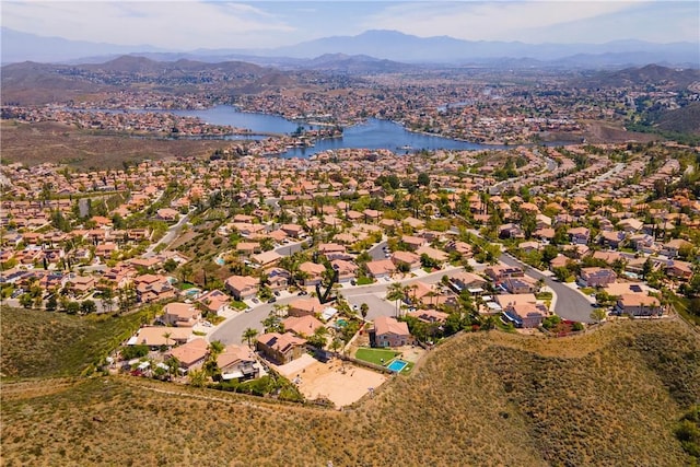 aerial view with a water and mountain view and a residential view