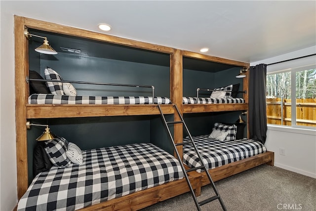 carpeted bedroom featuring baseboards