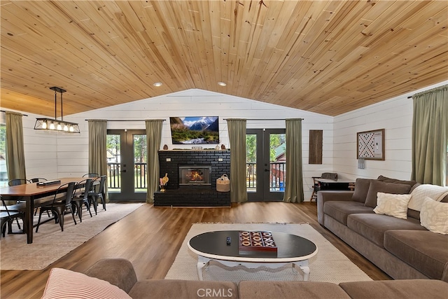 living room with vaulted ceiling, wooden ceiling, wood finished floors, and french doors