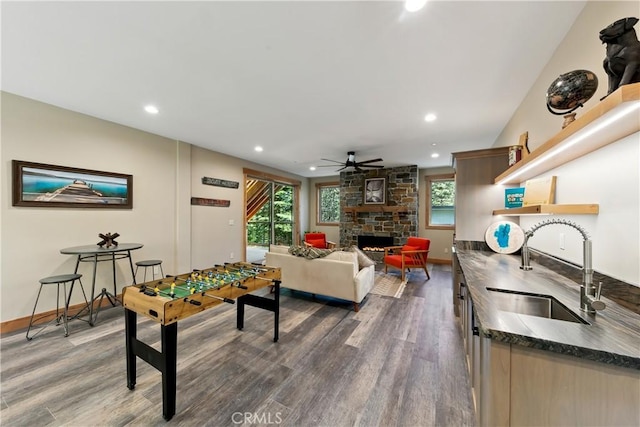 867 Clement St, South Lake Tahoe, CA 96150 - game room featuring ceiling fan, wood finished floors, recessed lighting, and a fireplace