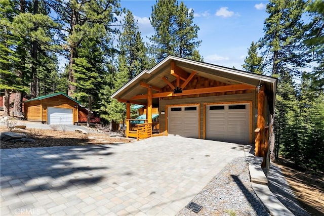 867 Clement St, South Lake Tahoe, CA 96150 - view of front of property featuring decorative driveway and an outdoor structure