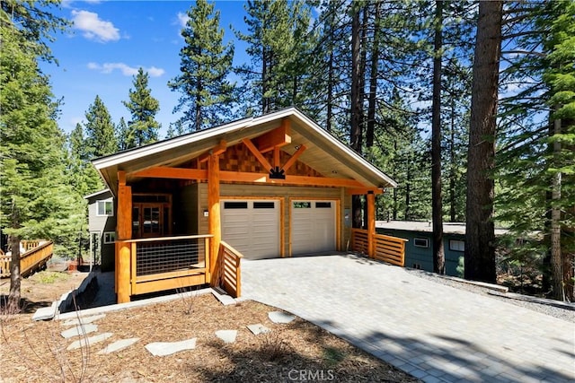 867 Clement St, South Lake Tahoe, CA 96150 - garage featuring decorative driveway