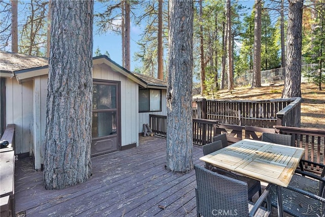 deck with outdoor dining space