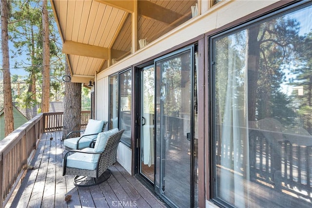 sunroom featuring beamed ceiling