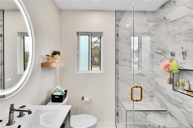 12643 Gladstone Ave, Sylmar, CA 91342 - full bathroom featuring vanity, toilet, baseboards, and a marble finish shower