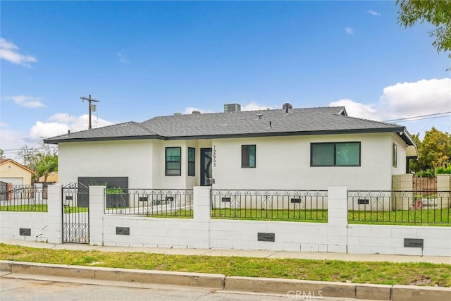 12643 Gladstone Ave, Sylmar, CA 91342 - ranch-style home featuring stucco siding, a shingled roof, a fenced front yard, and a gate