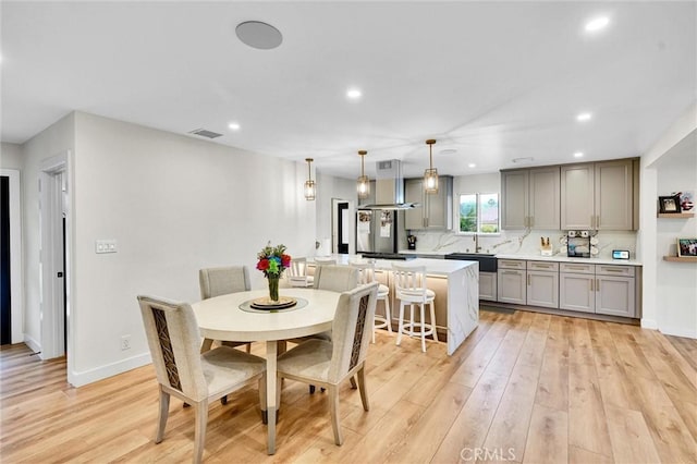 12643 Gladstone Ave, Sylmar, CA 91342 - dining room with baseboards, recessed lighting, visible vents, and light wood-style flooring