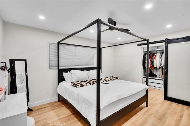 12643 Gladstone Ave, Sylmar, CA 91342 - bedroom featuring a baseboard heating unit, a ceiling fan, light wood-style floors, and recessed lighting