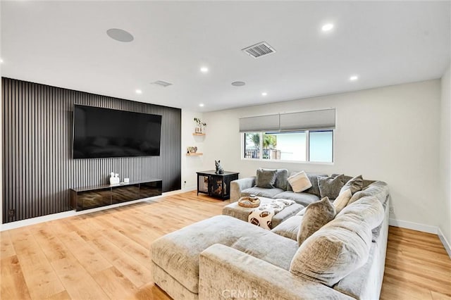 12643 Gladstone Ave, Sylmar, CA 91342 - living area with baseboards, wood finished floors, visible vents, and recessed lighting