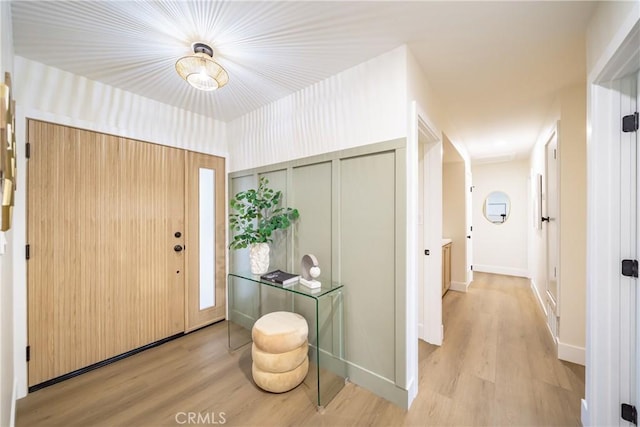 entryway with wood finished floors