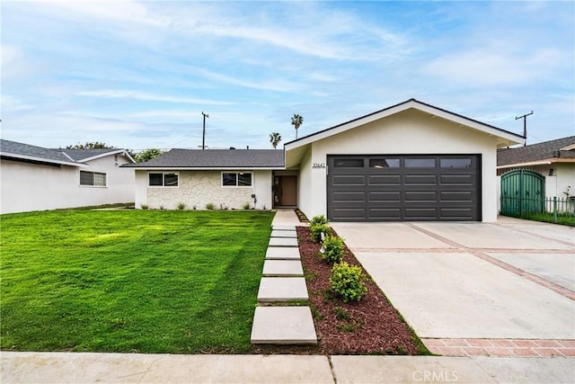 ranch-style house with concrete driveway, stucco siding, a front yard, and a garage