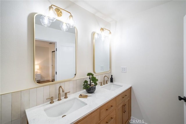 bathroom with double vanity and a sink