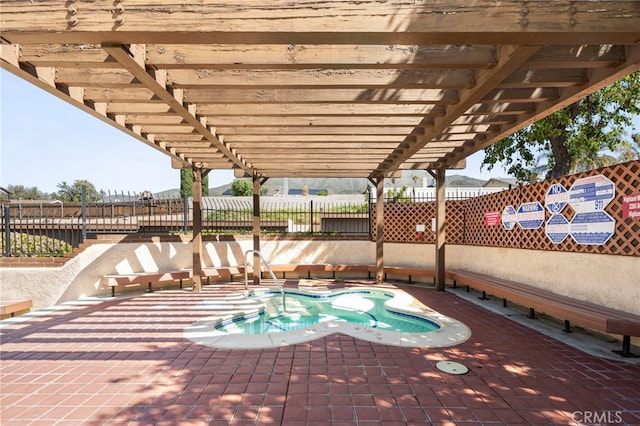 2265 Bradford Ave Unit 516, Highland, CA 92346 - view of pool with a hot tub, a fenced backyard, and a pergola