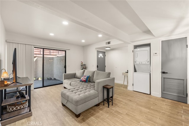 2265 Bradford Ave Unit 516, Highland, CA 92346 - living room with estacked washer and dryer, light wood-type flooring, recessed lighting, and baseboards