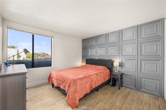 2265 Bradford Ave Unit 516, Highland, CA 92346 - bedroom with light wood-style flooring and baseboards