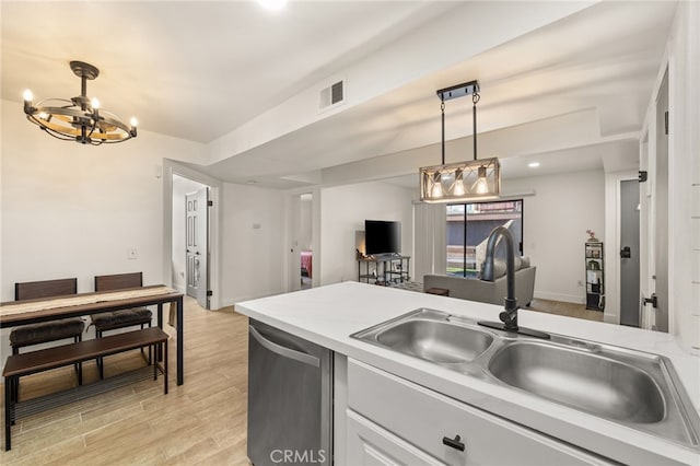 2265 Bradford Ave Unit 516, Highland, CA 92346 - kitchen featuring stainless steel dishwasher, a chandelier, a sink, light wood-type flooring, and decorative light fixtures