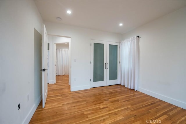 interior space with recessed lighting, light wood-style floors, and baseboards