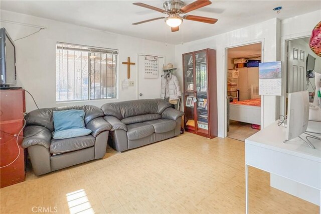 927 E 28th St, Los Angeles, CA 90011 - living area featuring a ceiling fan and tile patterned floors