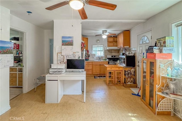 927 E 28th St, Los Angeles, CA 90011 - office space featuring ceiling fan, a sink, and light floors