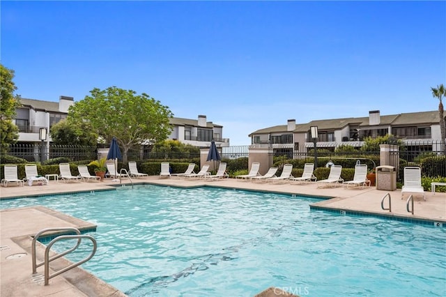 230 Lille Ln Unit 214, Newport Beach, CA 92663 - pool with a patio area and fence
