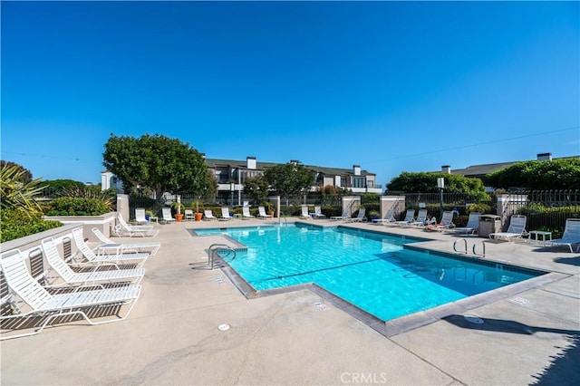 230 Lille Ln Unit 214, Newport Beach, CA 92663 - community pool featuring a patio and fence