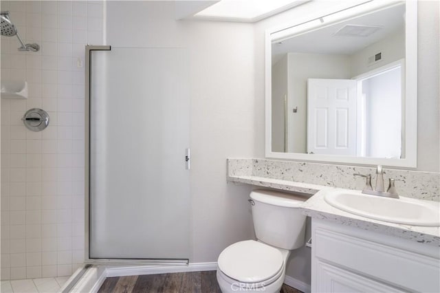 230 Lille Ln Unit 214, Newport Beach, CA 92663 - bathroom with a shower stall, vanity, and wood finished floors