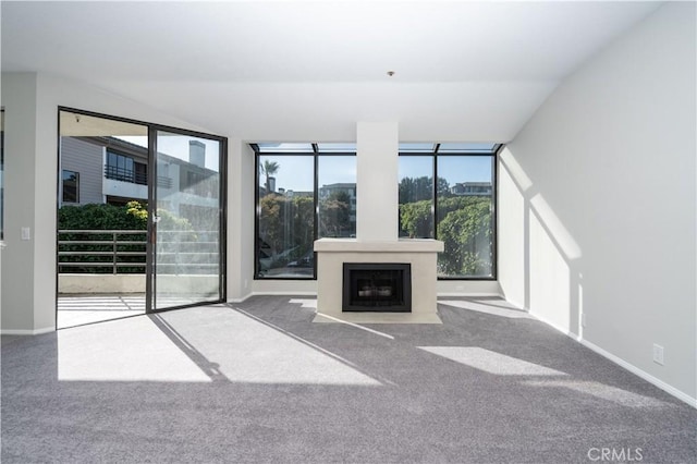 230 Lille Ln Unit 214, Newport Beach, CA 92663 - unfurnished living room with a wealth of natural light, carpet flooring, and baseboards