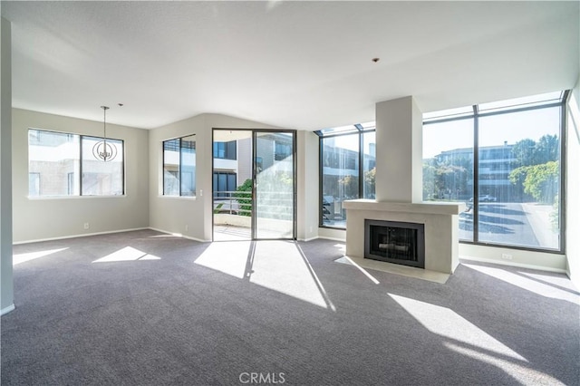 230 Lille Ln Unit 214, Newport Beach, CA 92663 - unfurnished living room featuring a fireplace with flush hearth, carpet floors, and baseboards