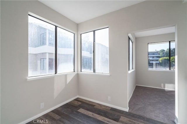 230 Lille Ln Unit 214, Newport Beach, CA 92663 - unfurnished room featuring baseboards and dark wood finished floors