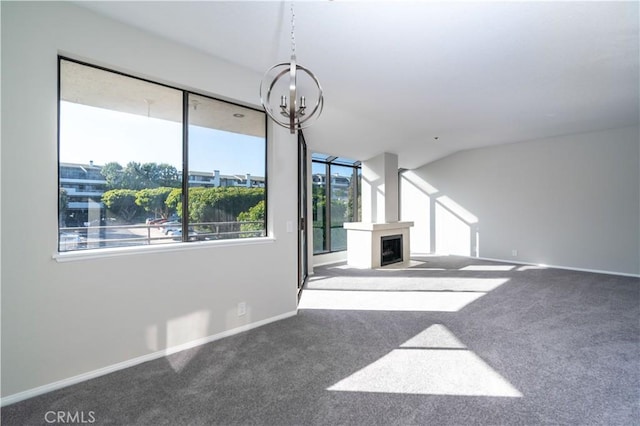 230 Lille Ln Unit 214, Newport Beach, CA 92663 - unfurnished living room featuring a chandelier, carpet, and a fireplace