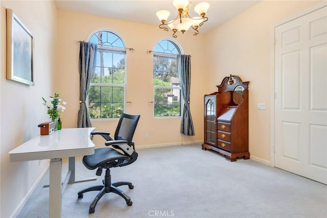 home office featuring carpet flooring, baseboards, and a notable chandelier