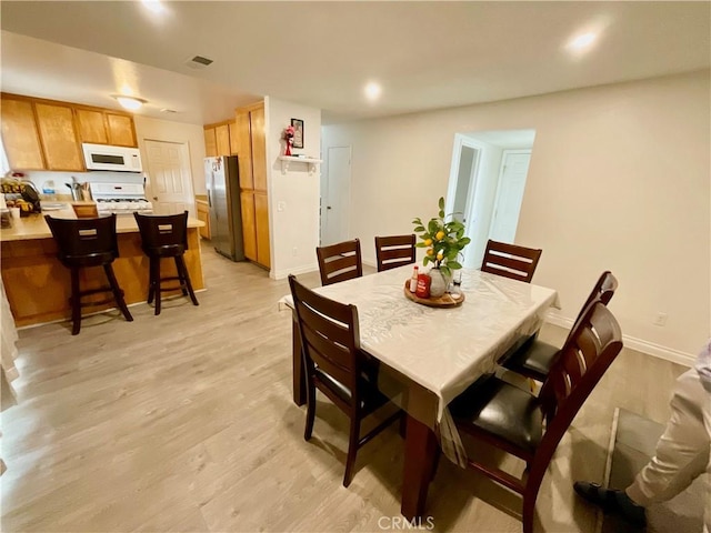 1078 W King St, Banning, CA 92220 - dining area with visible vents, light wood-type flooring, recessed lighting, and baseboards