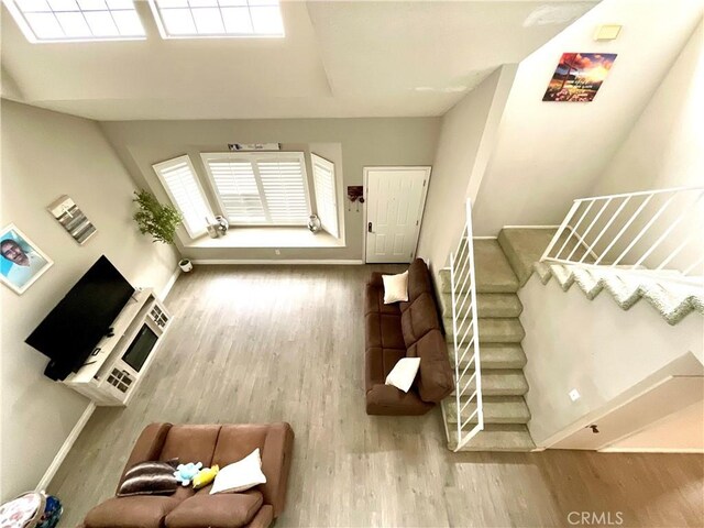1078 W King St, Banning, CA 92220 - living room with baseboards, wood finished floors, and stairs