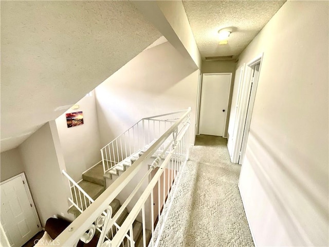 1078 W King St, Banning, CA 92220 - hallway with a textured ceiling and carpet
