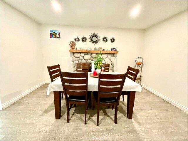 1078 W King St, Banning, CA 92220 - dining room with baseboards and wood finished floors