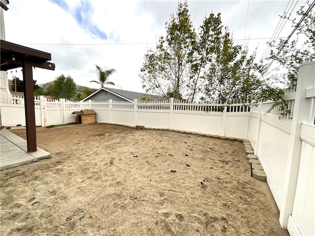 1078 W King St, Banning, CA 92220 - view of yard featuring a fenced backyard