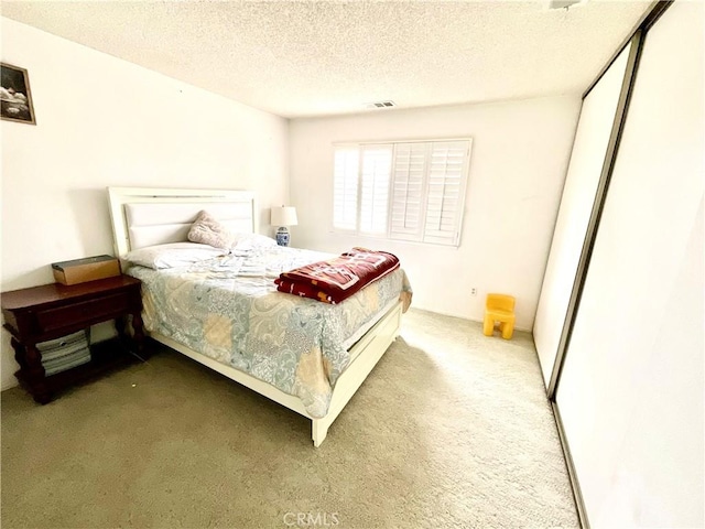 1078 W King St, Banning, CA 92220 - carpeted bedroom with a textured ceiling and visible vents