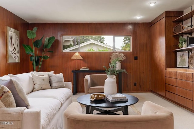 sitting room featuring wood walls