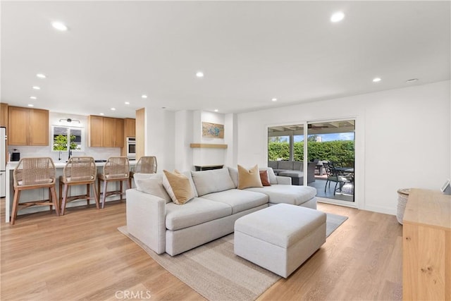 2343 E Athens Ave, Orange, CA 92867 - living room featuring recessed lighting, baseboards, a healthy amount of sunlight, and light wood-type flooring