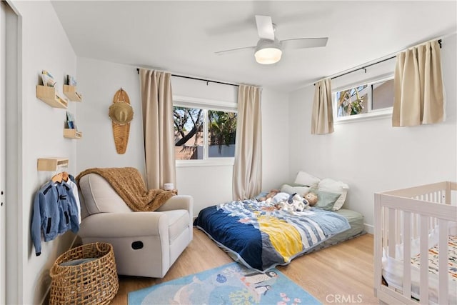 2343 E Athens Ave, Orange, CA 92867 - bedroom featuring ceiling fan, multiple windows, and wood finished floors